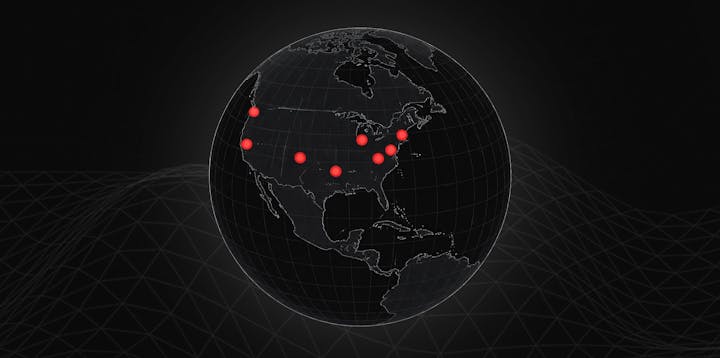 A globe with several locations in North America marked with red dots