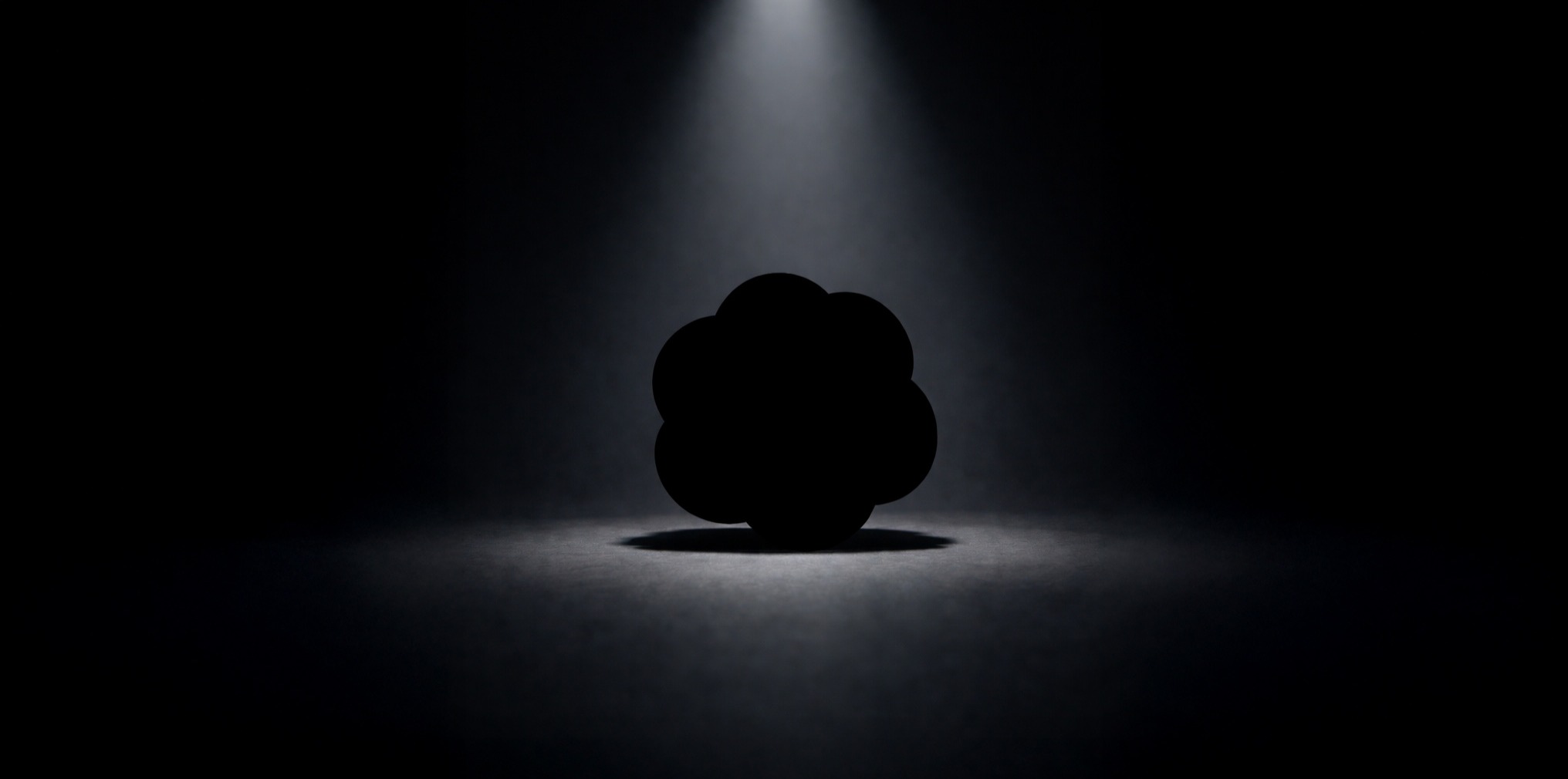 A silhouette of a ChatGPT logo