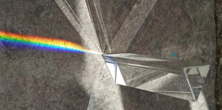 Picture of a prism reflecting a rainbow