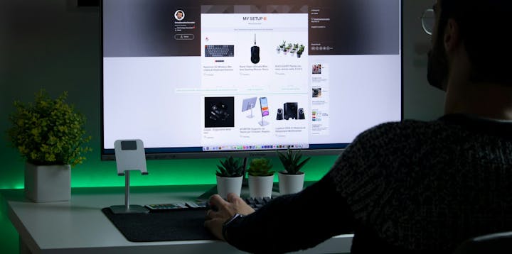 A developer sat looking at a computer screen